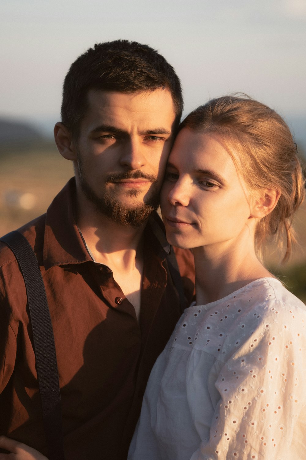 a man and woman posing for a selfie