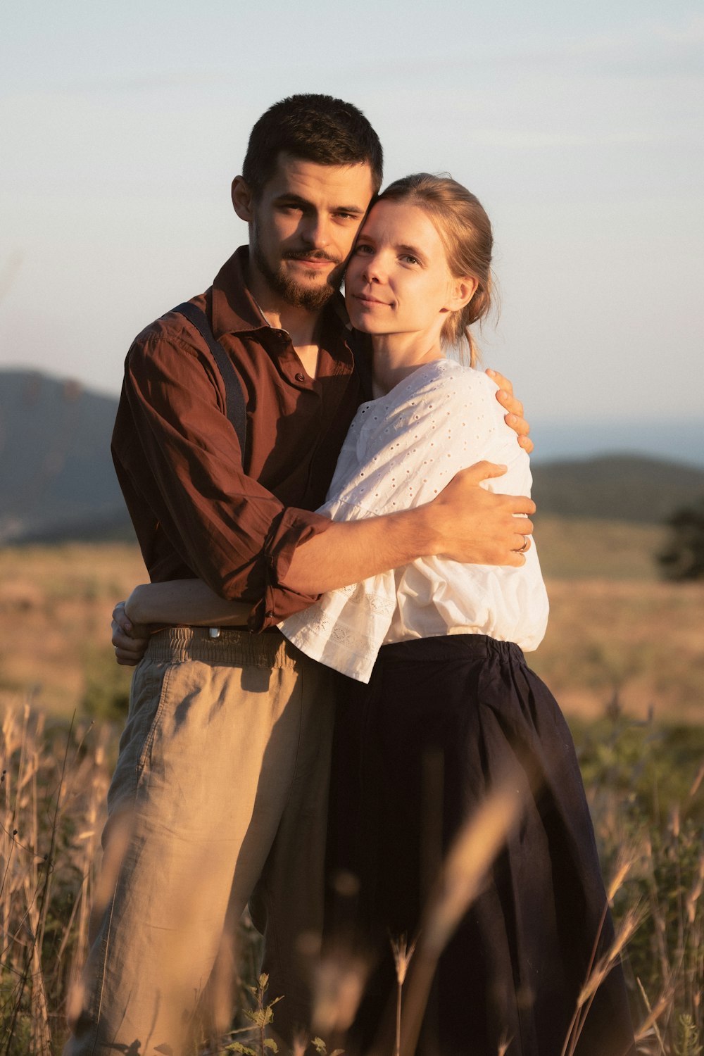 a man and woman posing for a picture