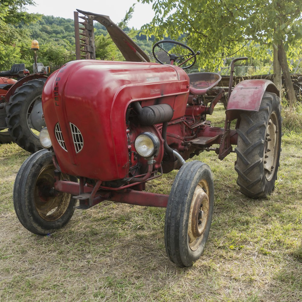 a red tractor on grass