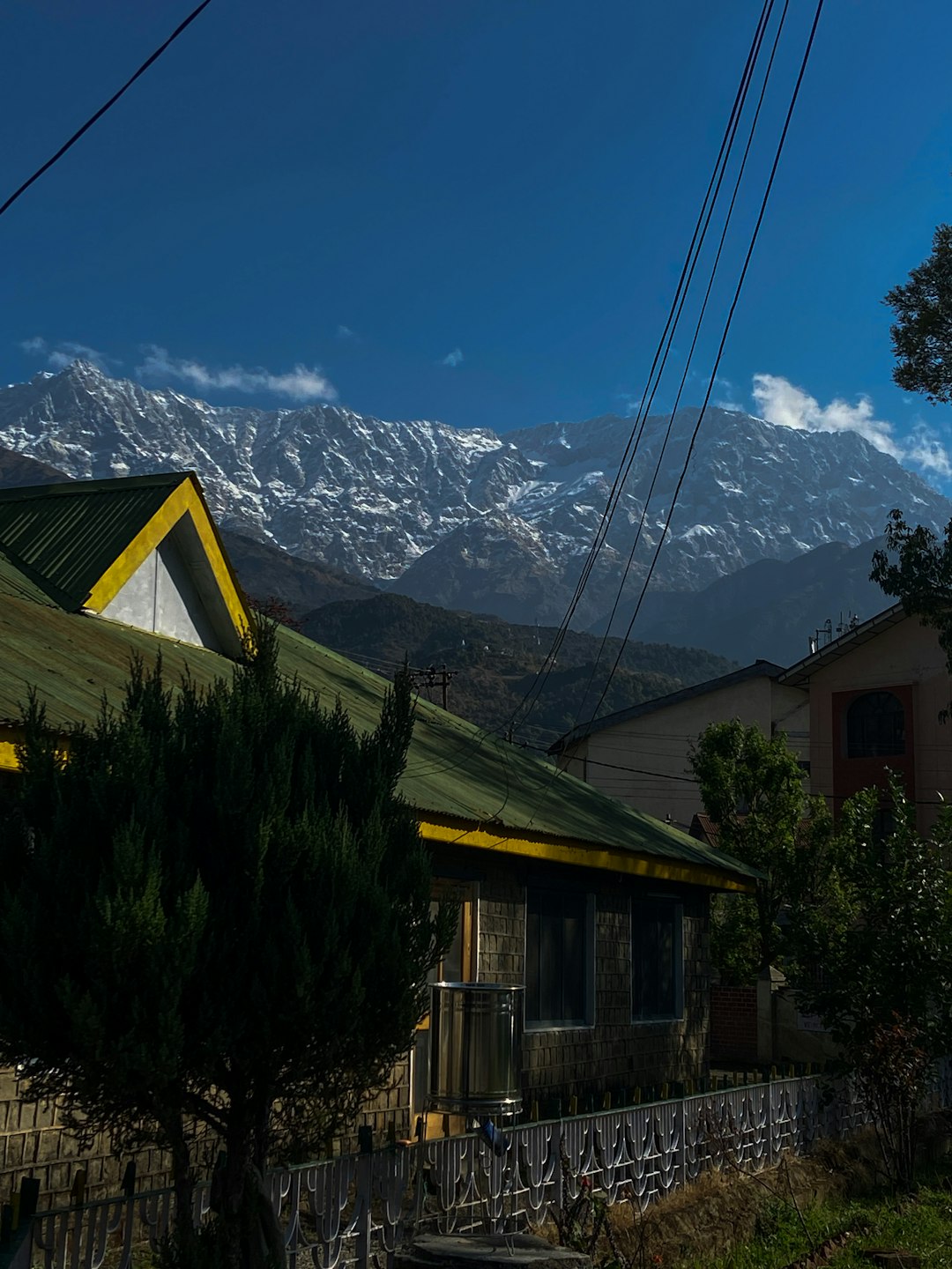 a house with a snowy mountain in the background