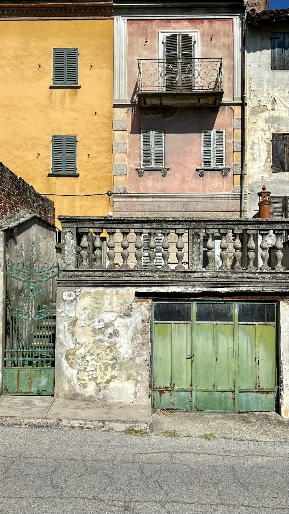 a building with a green door and a green door