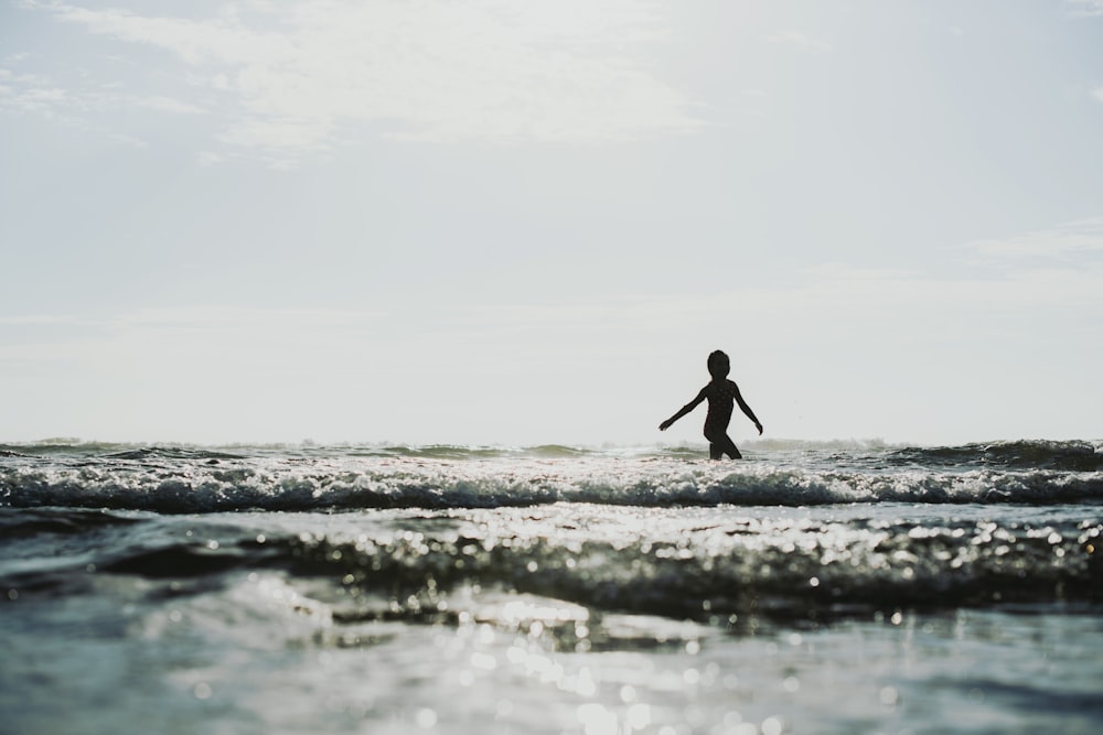 a person walking on a beach