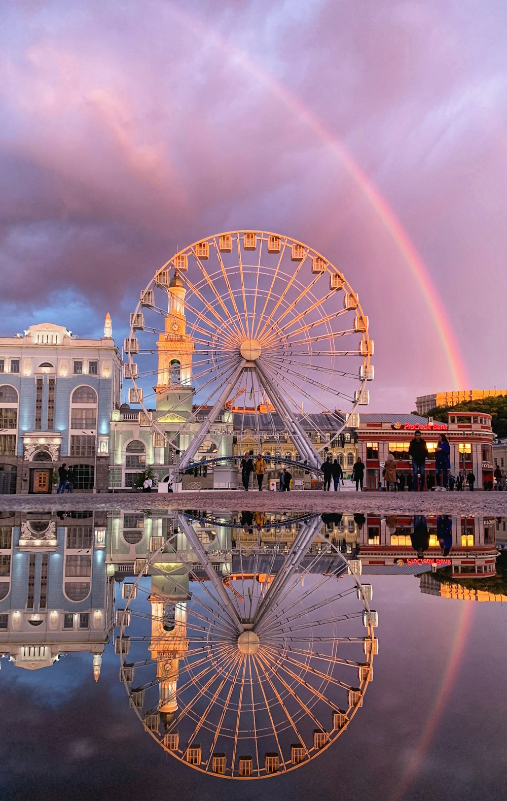 a ferris wheel in front of a building