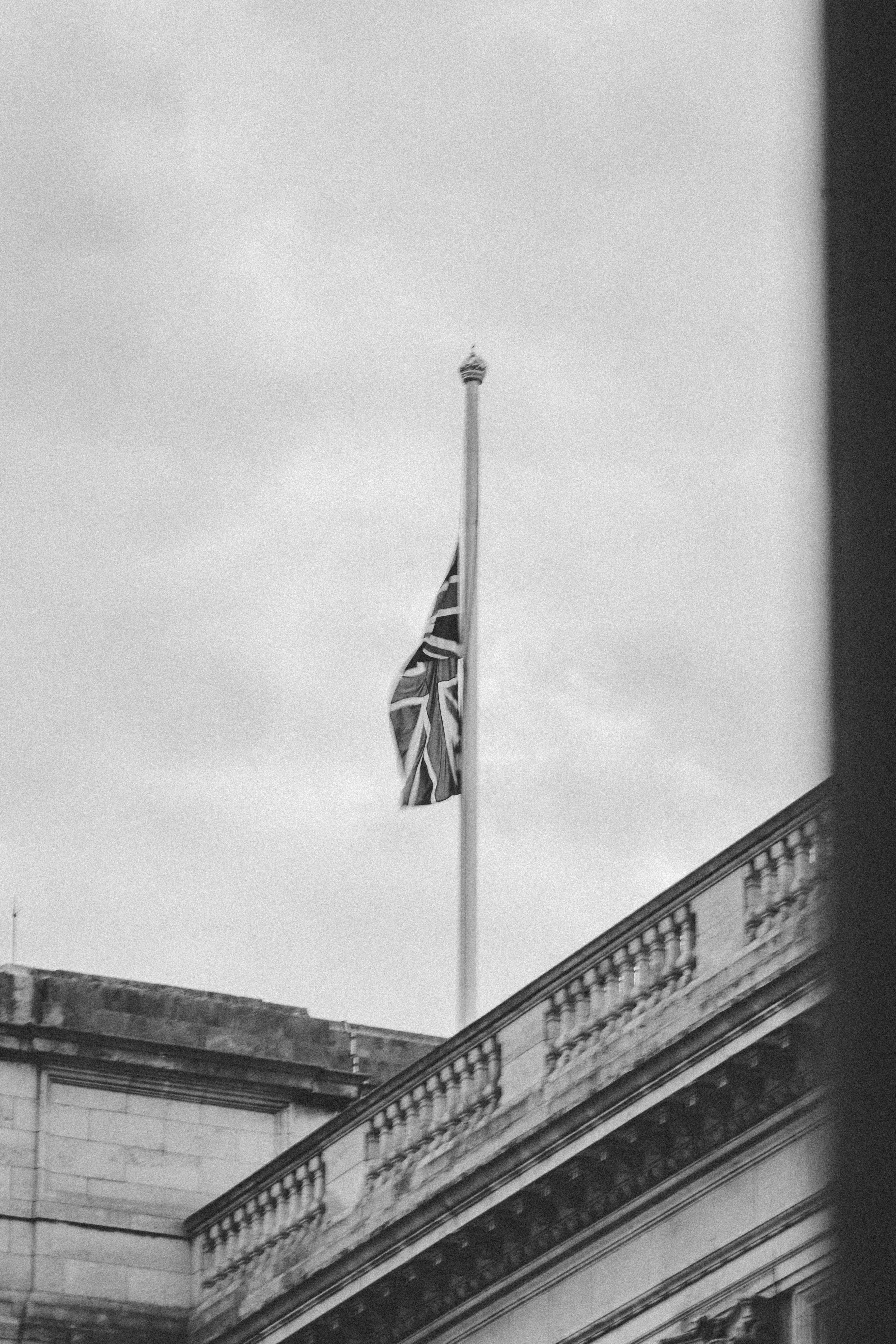 Outside Buckingham Palace, half-mast union jack