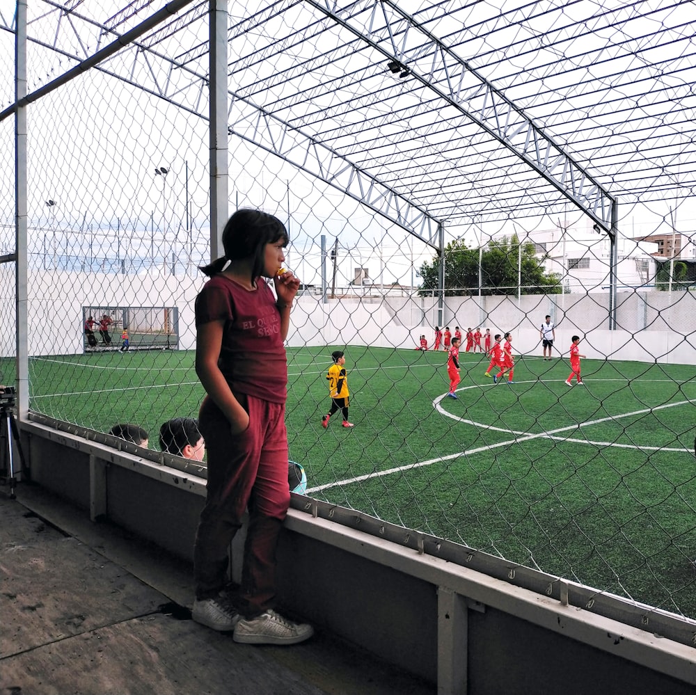 a person standing on a football field