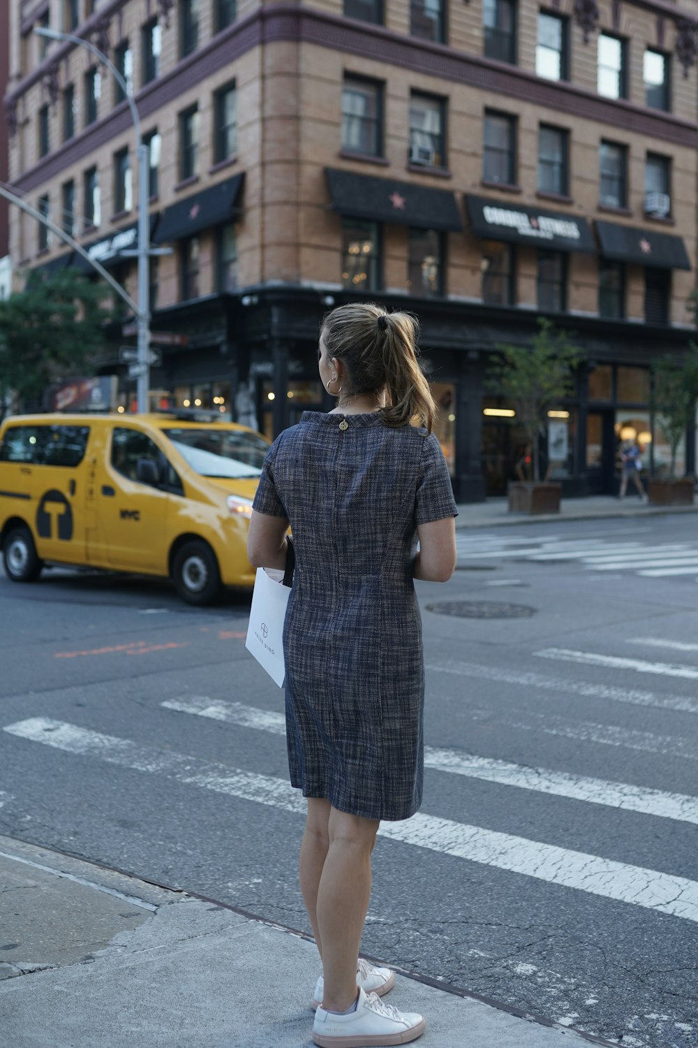 a person standing in the middle of a crosswalk