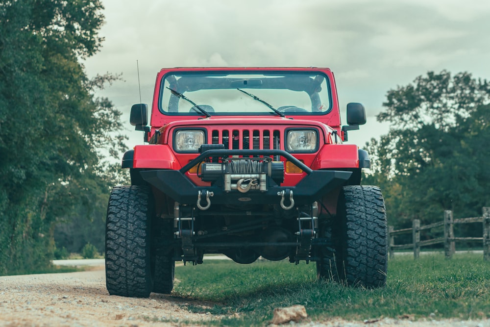 a red truck on a grassy field