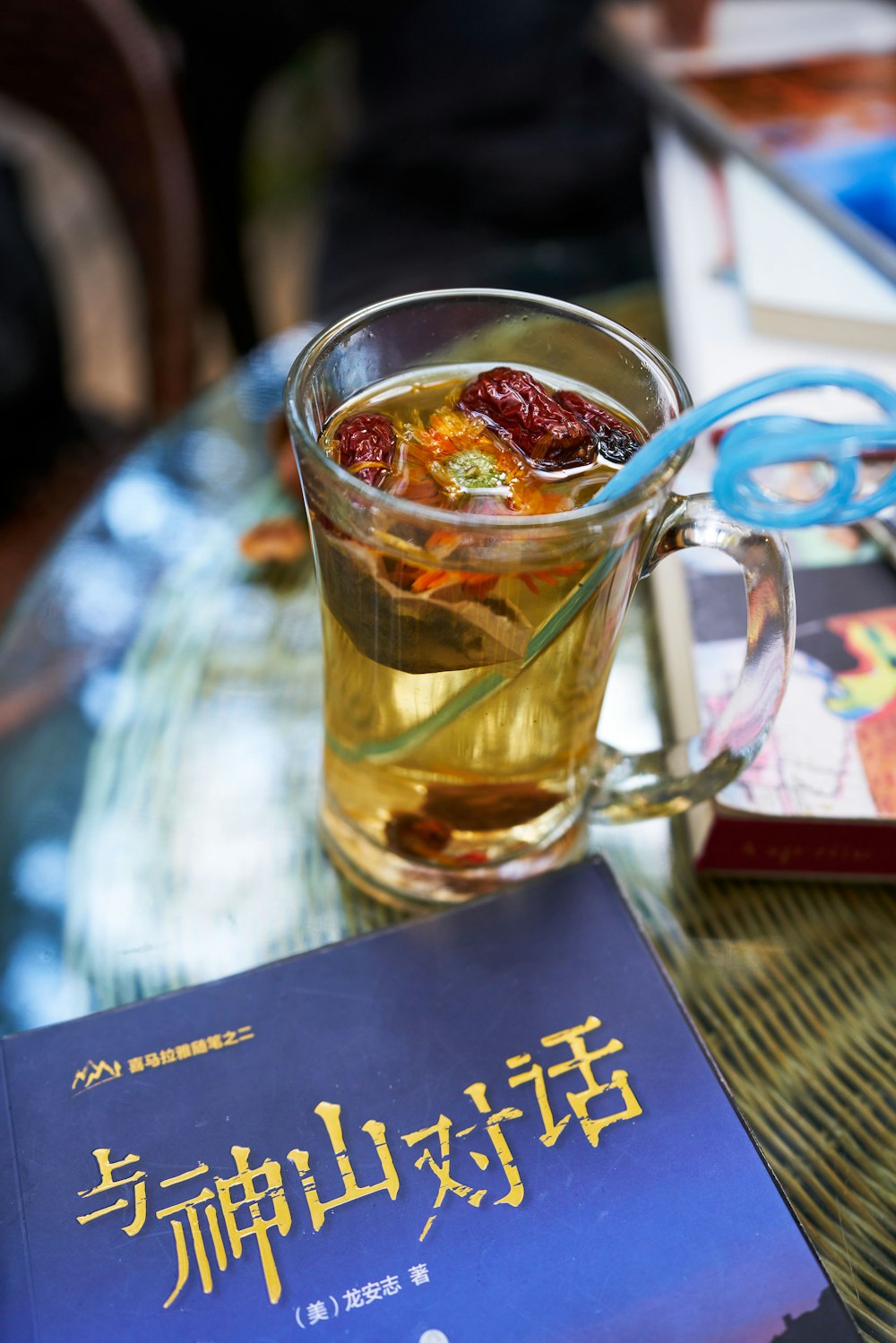 a glass of tea with a spoon