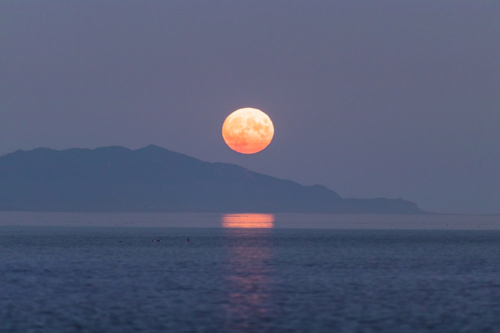 a sunset over a body of water