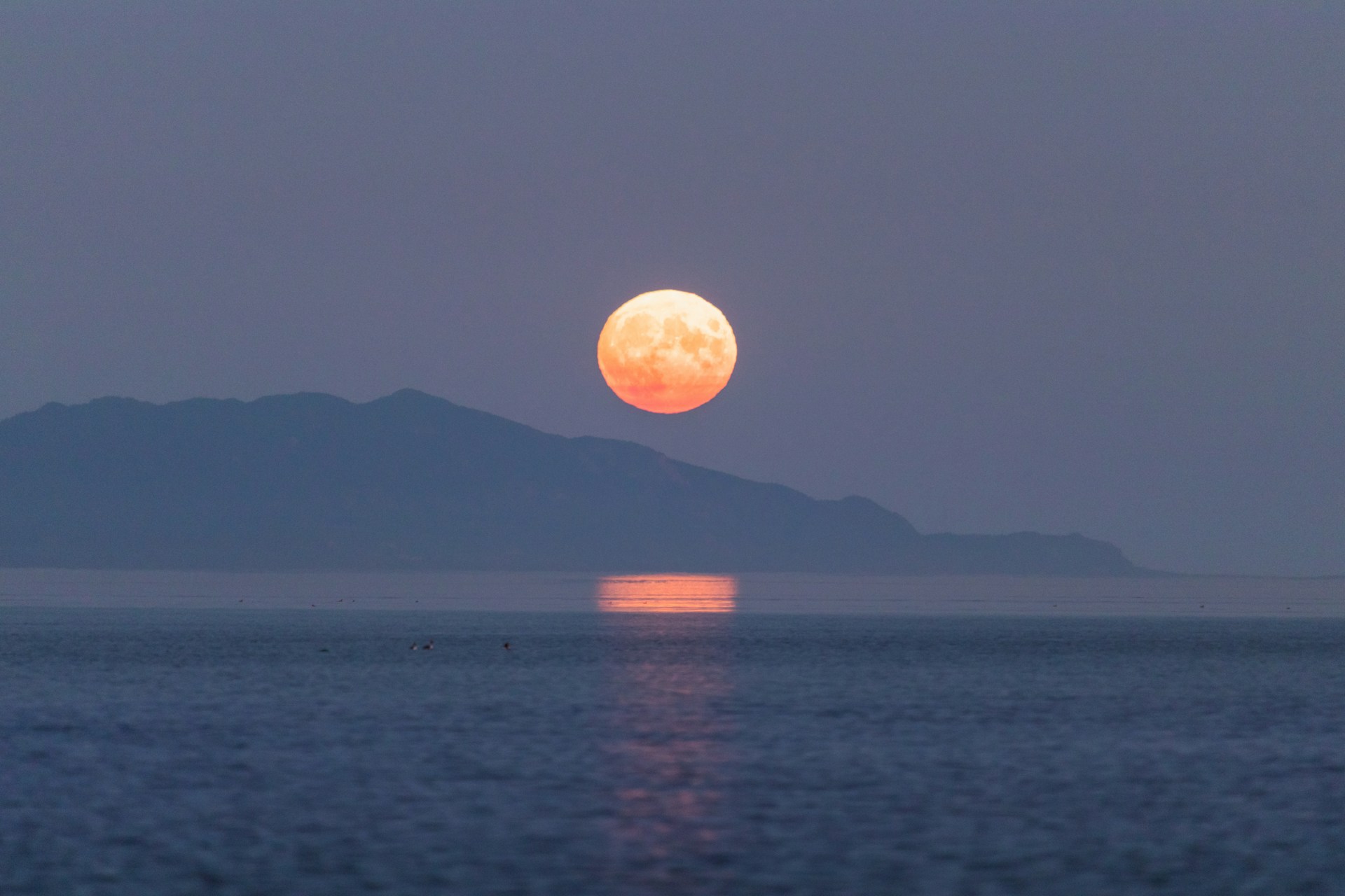 a sunset over a body of water