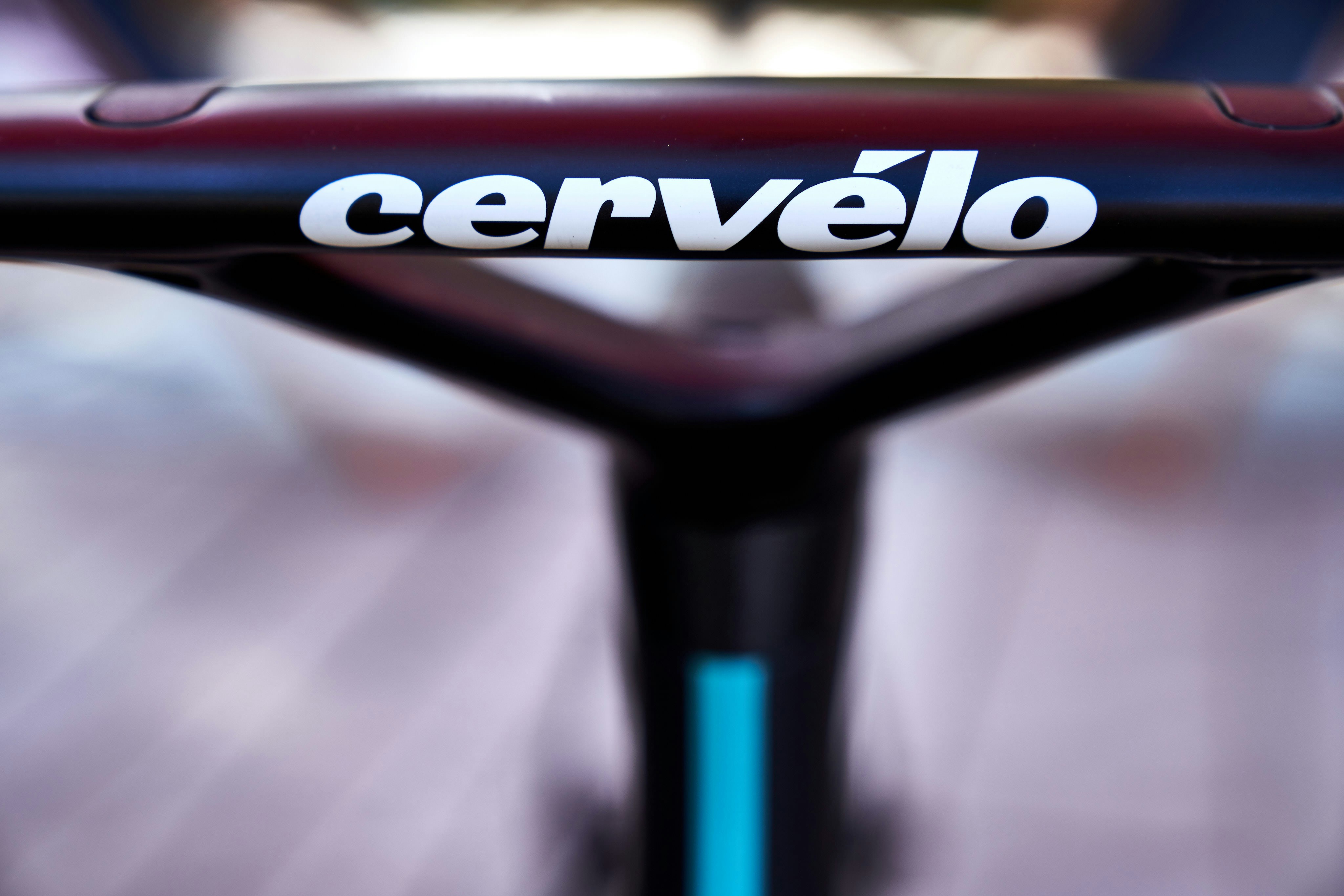 a close up of a black and red logo