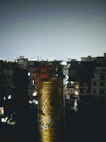 Lifestyle shot of a young adult holding a Divorox can with city lights blurred in the background.