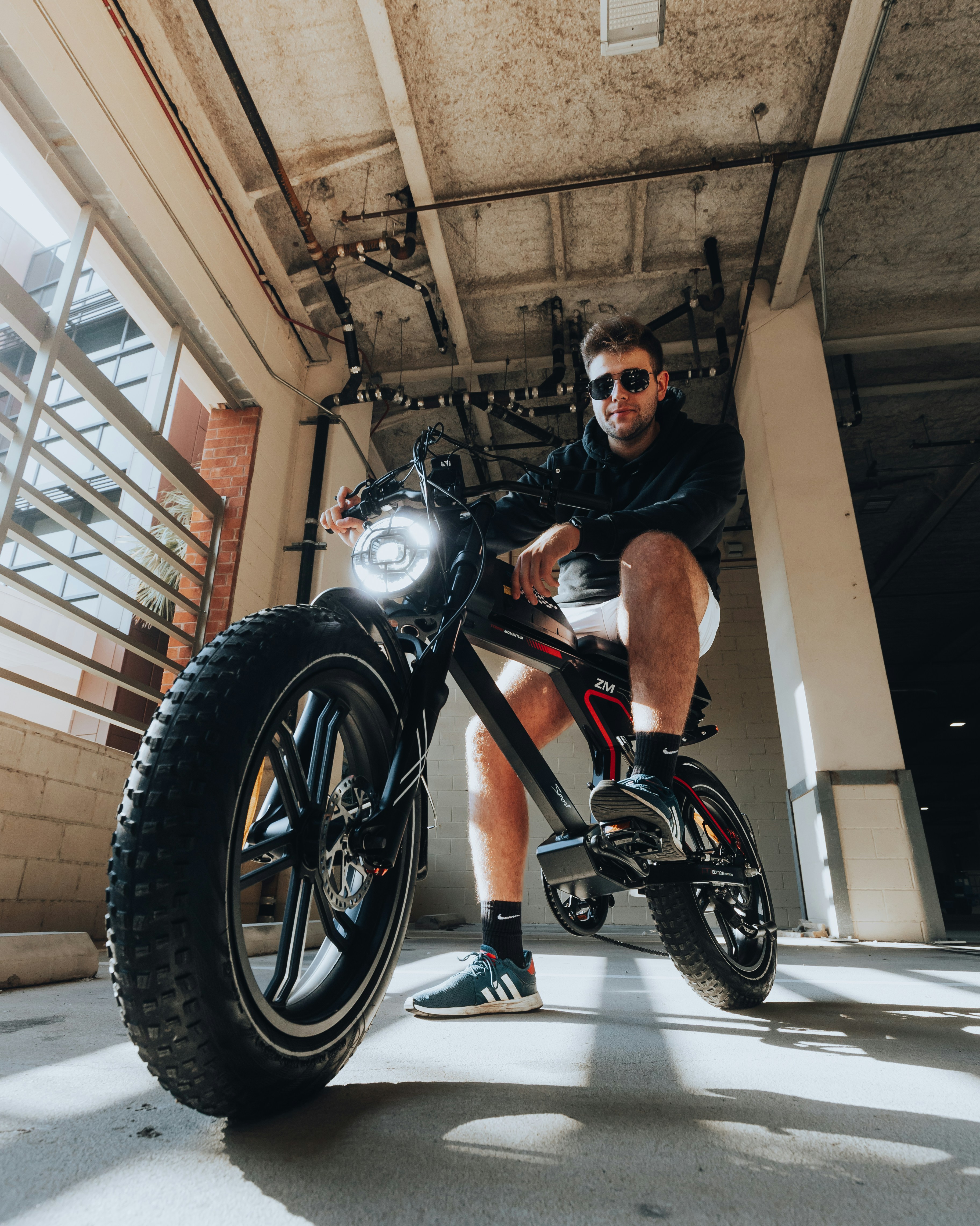a man sitting on a motorcycle