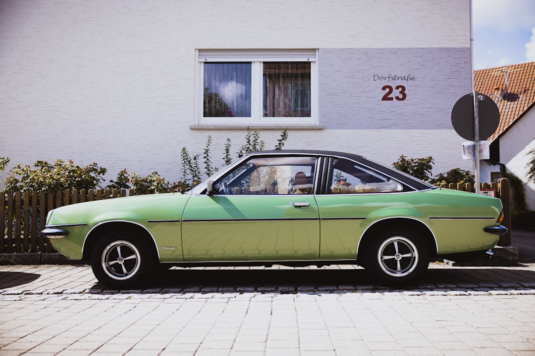 a green car parked on the side of a road, Opel Manta – German Classic Car & Vintage Oldtimer