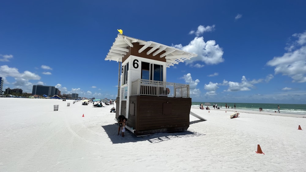 a small building on a beach