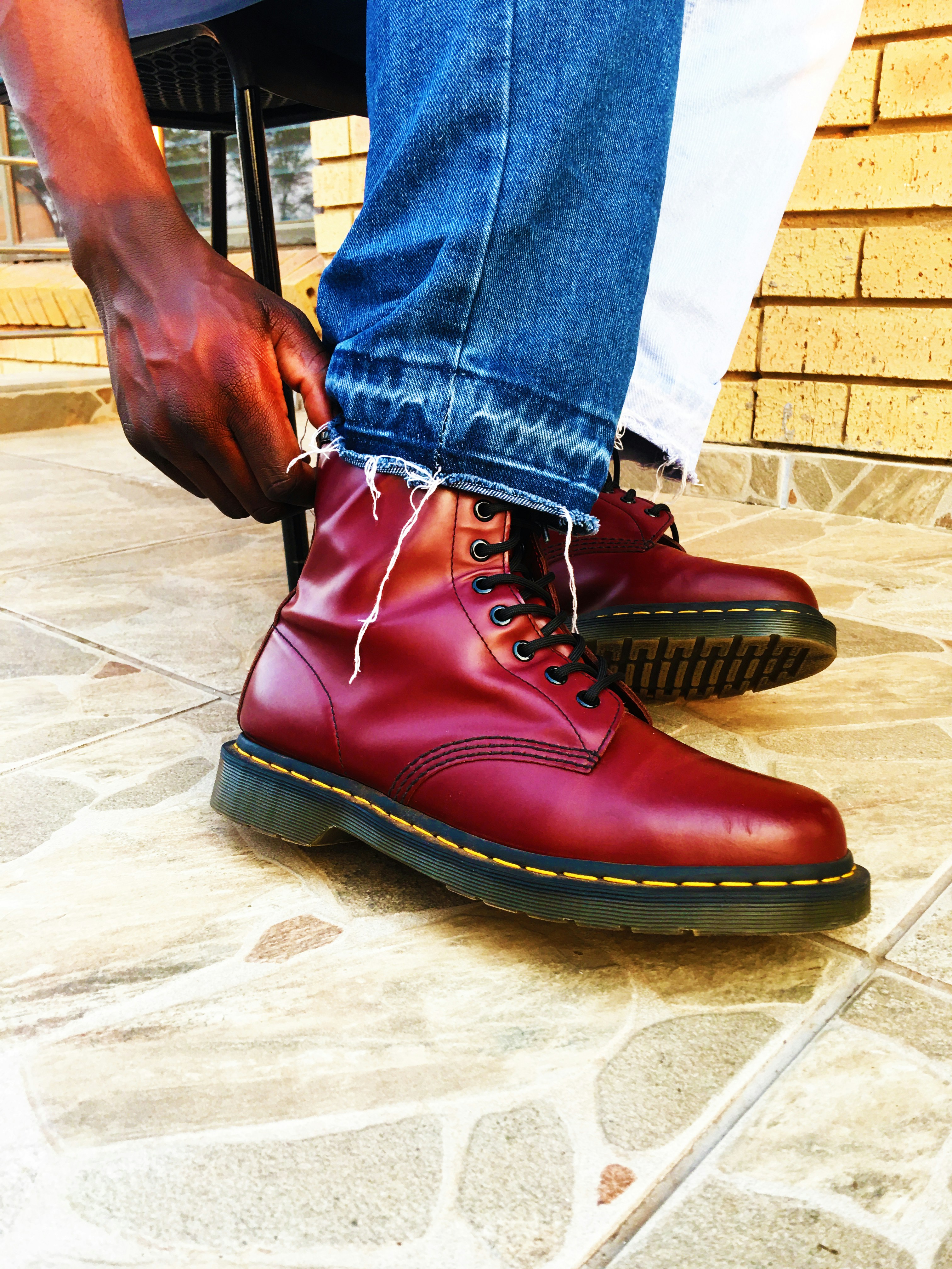 a person wearing red shoes