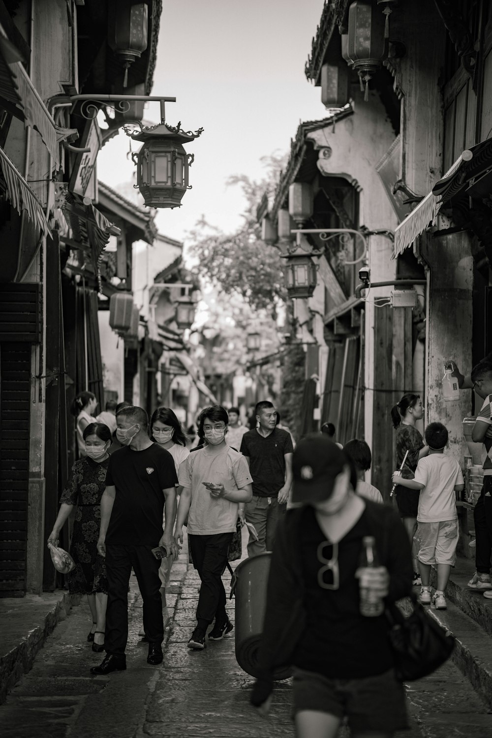 a group of people walking down a street