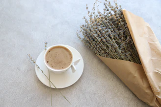 Minimalist aroma pouch resting on beige linen fabric with gentle morning light.