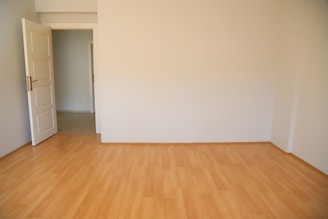 An empty room virtually staged with subtle, UK-style furniture creating a welcoming atmosphere.