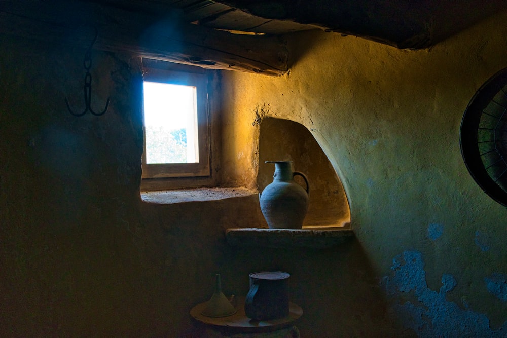 a vase and a window in a room