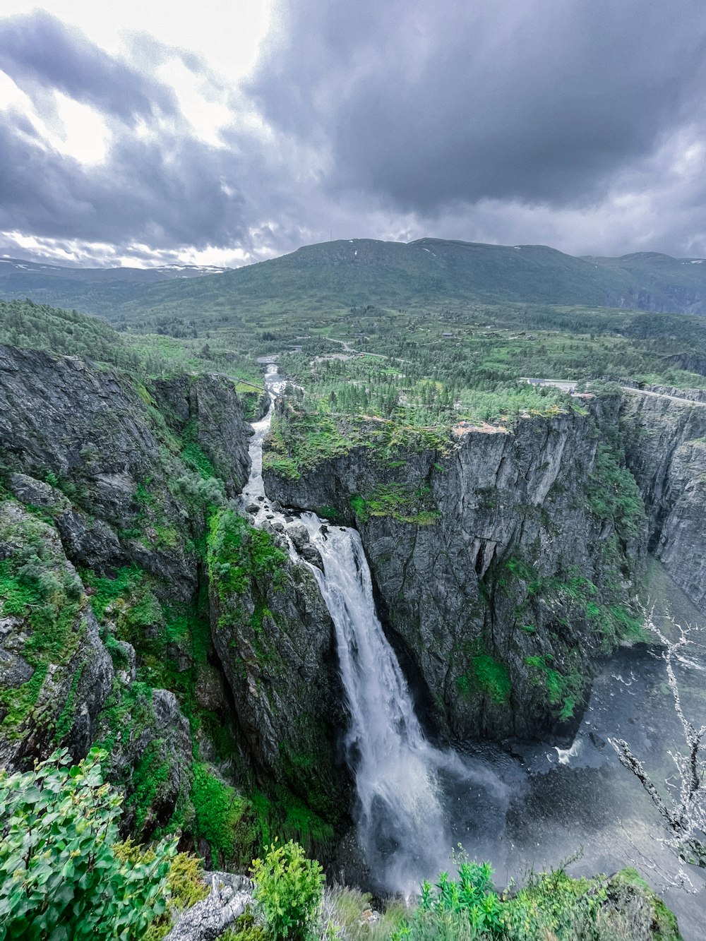 a waterfall in a valley