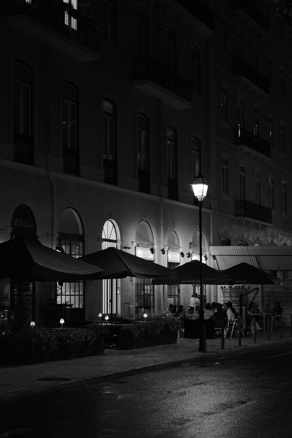 a street with umbrellas and people