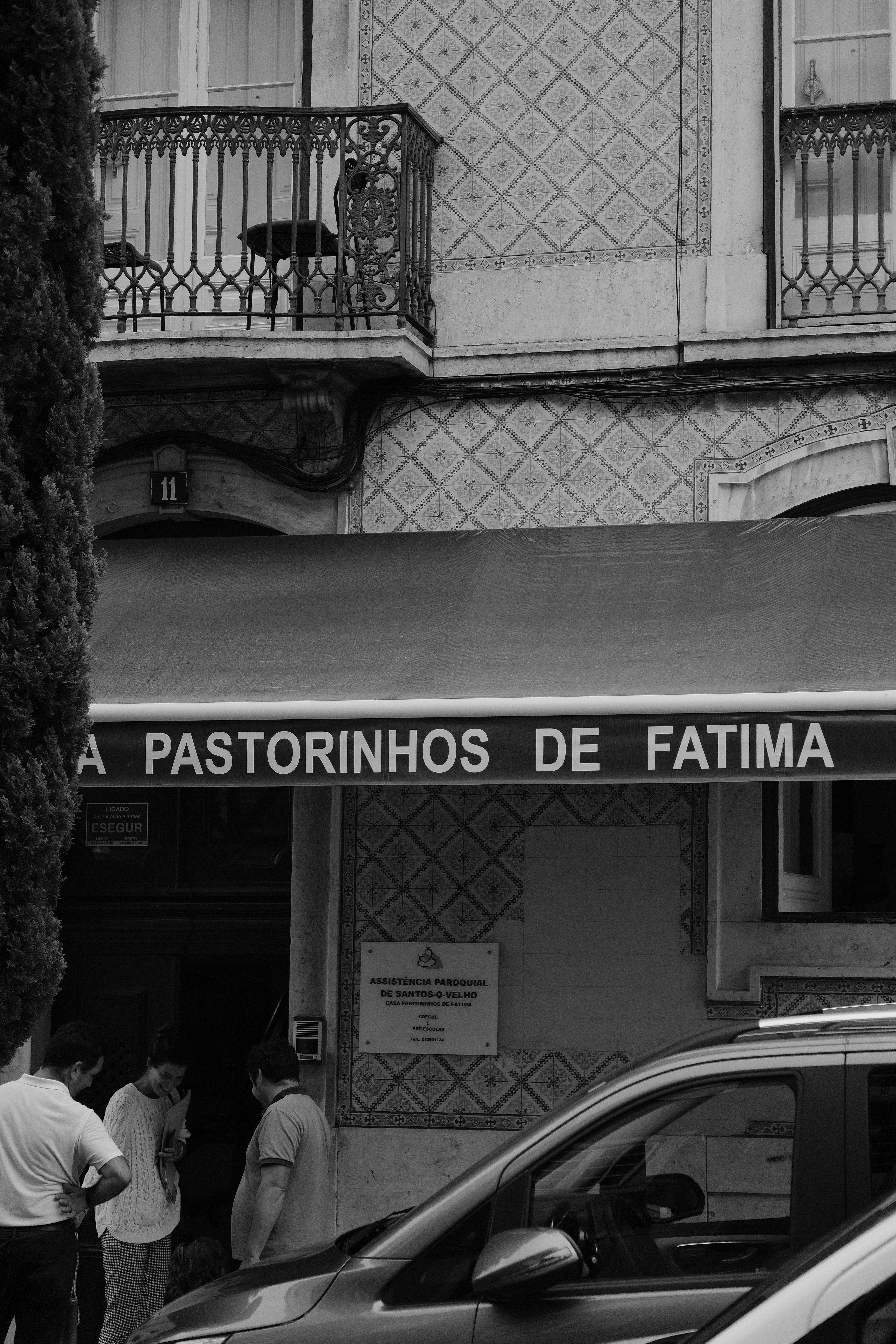 a group of people standing outside a building