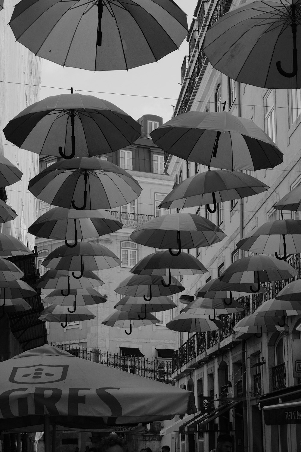 several umbrellas from a ceiling