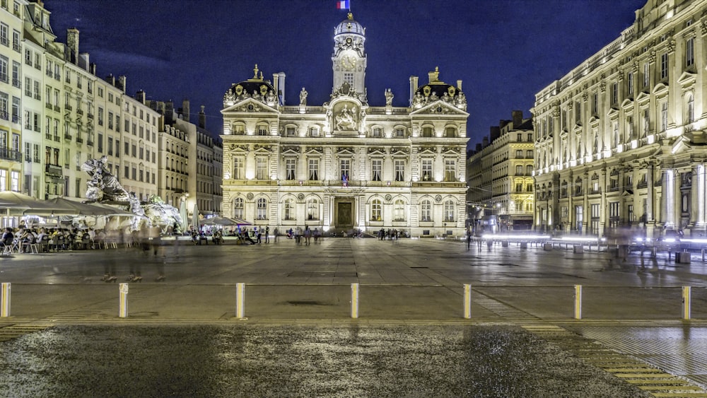 a large building with a fountain in front of it