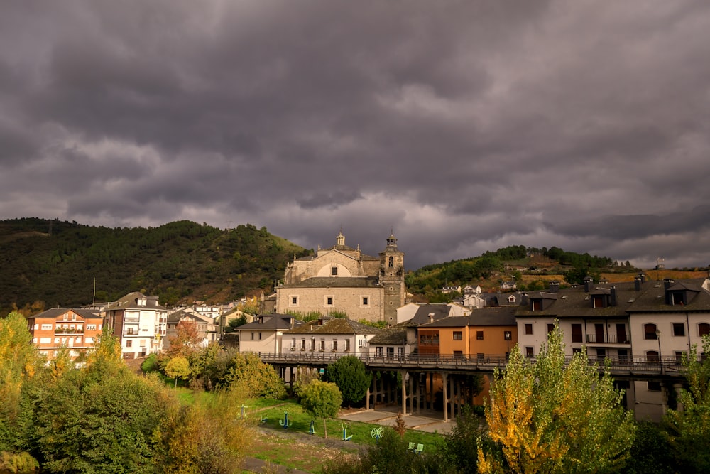 a group of buildings with trees in the back