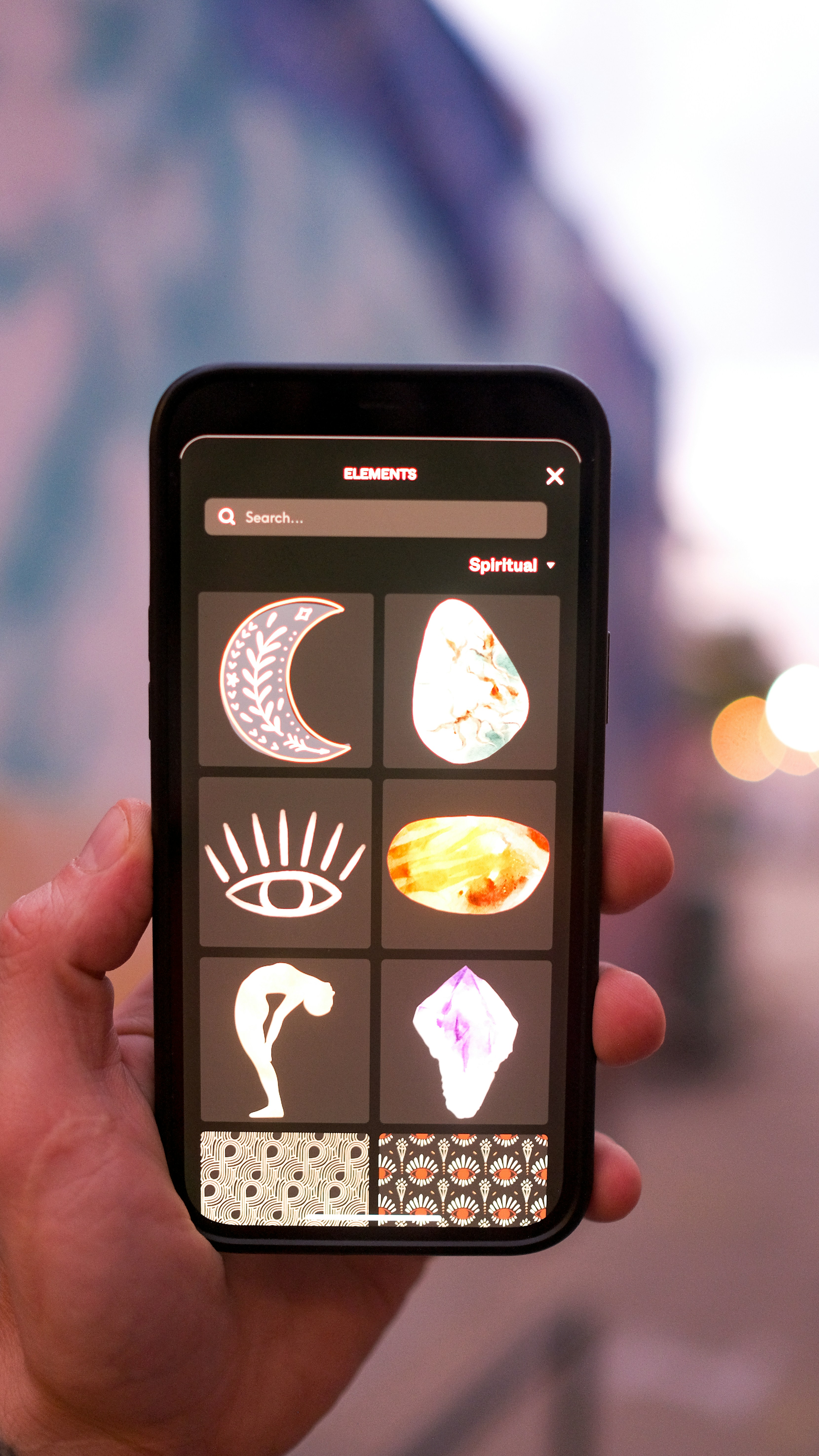 a hand holding a cell phone