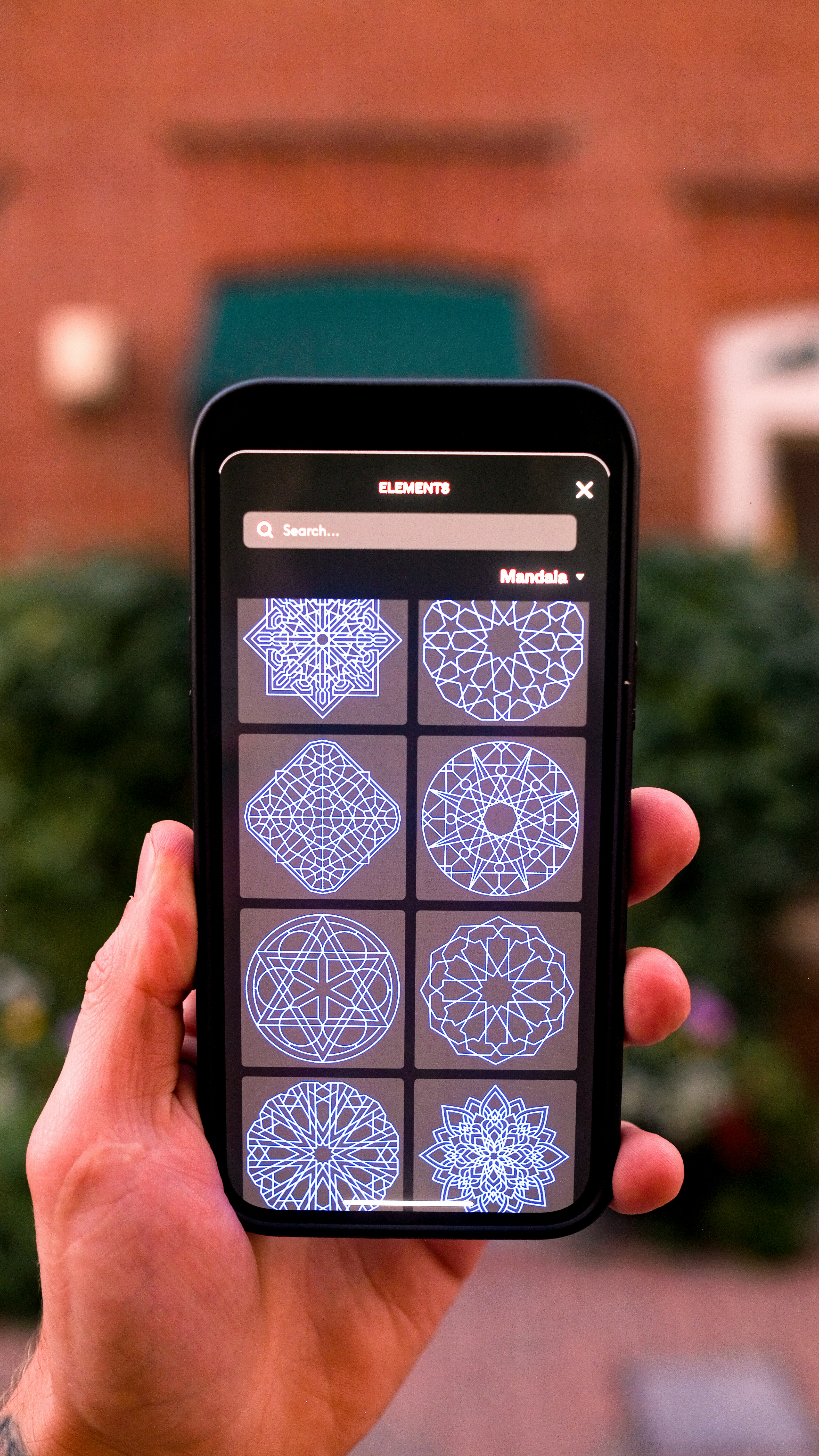 a hand holding a smart phone