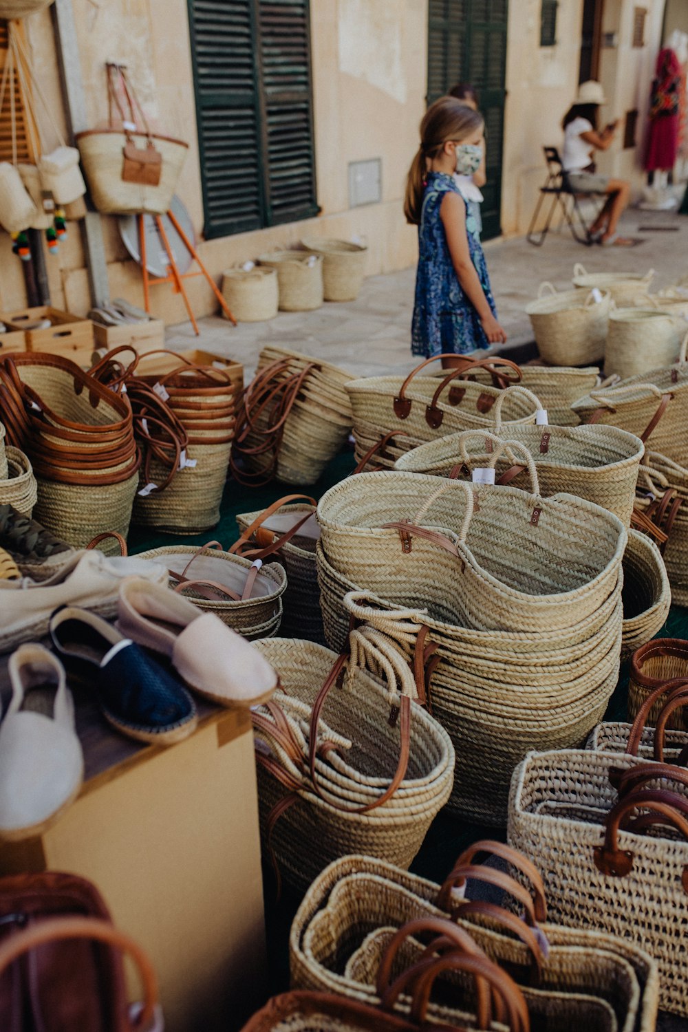 a person standing next to baskets