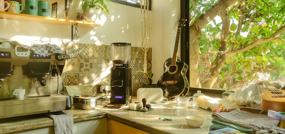 a kitchen with guitars and other objects