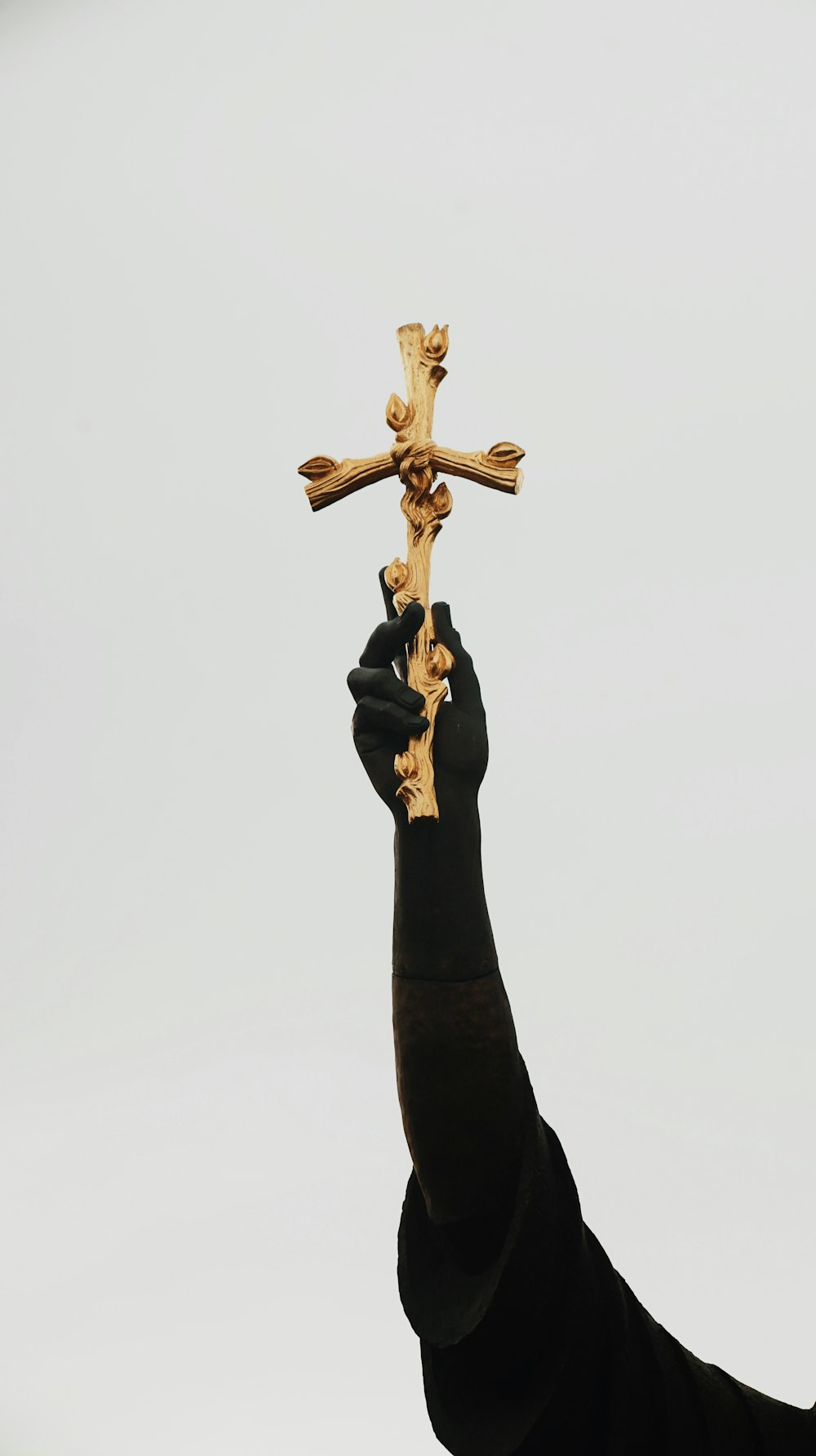 a person holding a cross