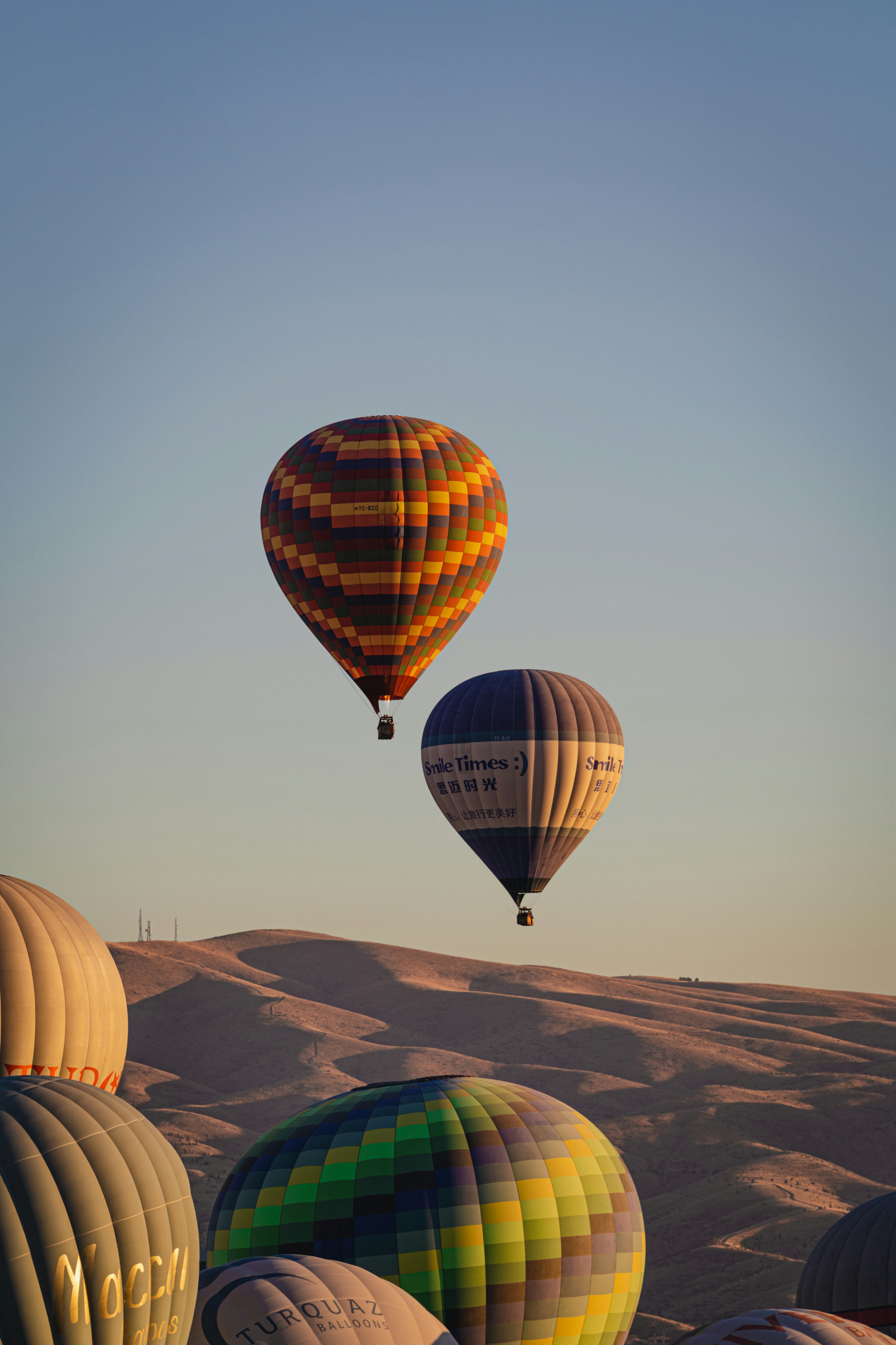 a group of hot air balloons in the sky