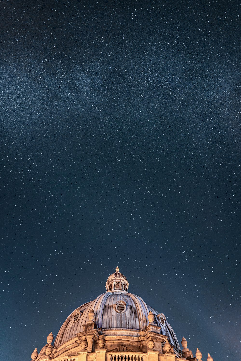 a domed building with a starry sky above