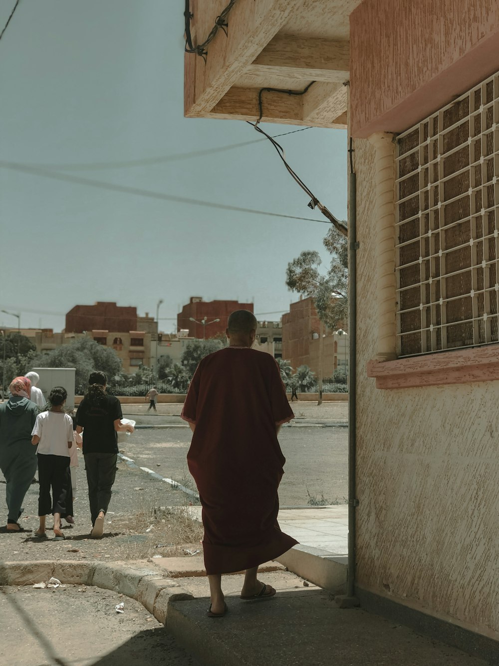 a group of people walking on a street