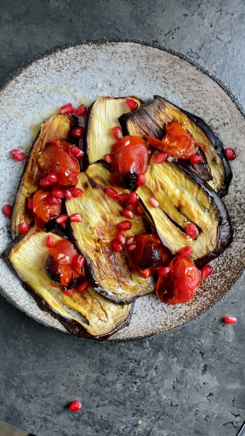 Roasted eggplant and tomato on a plate