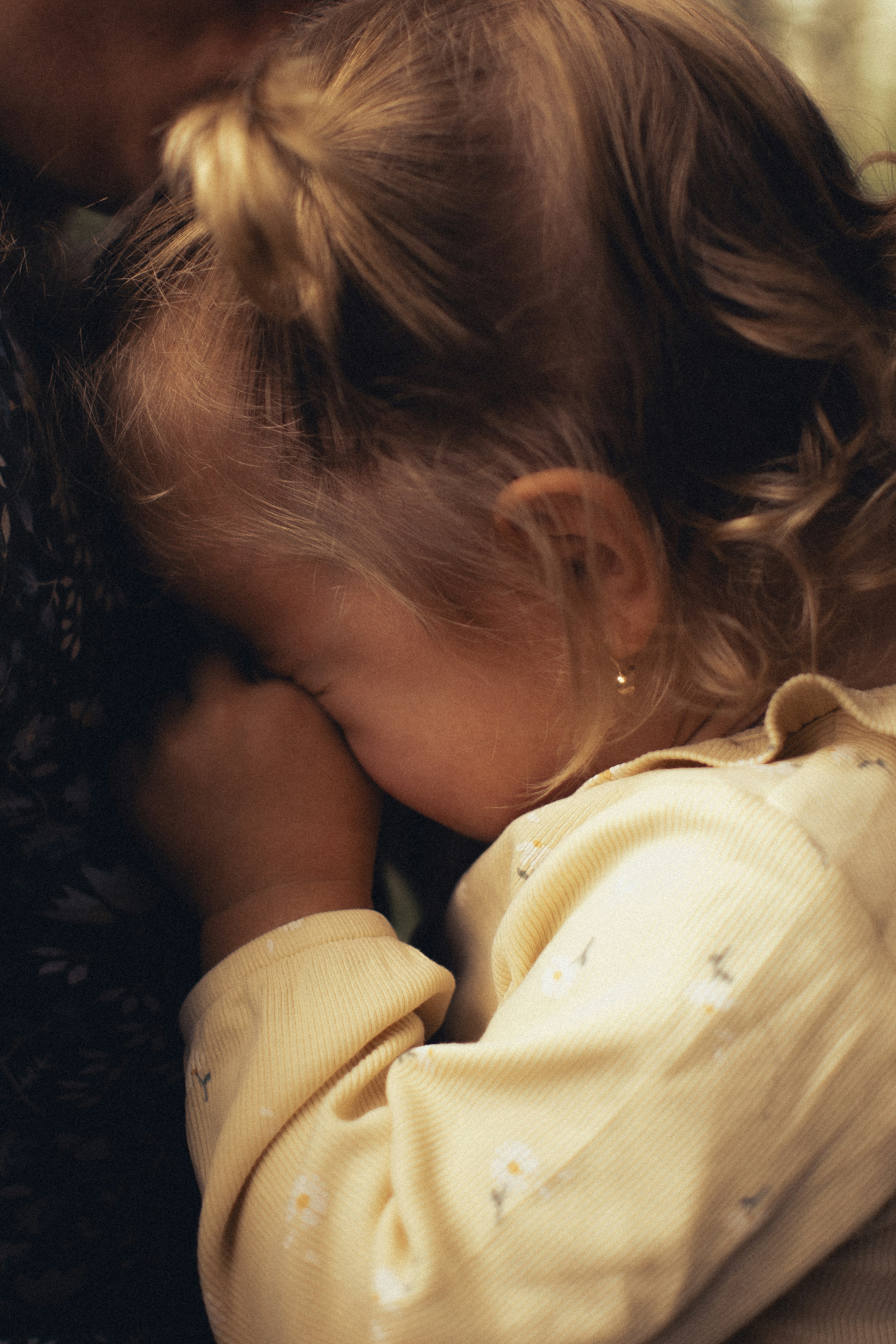 Toddler wiping away tears