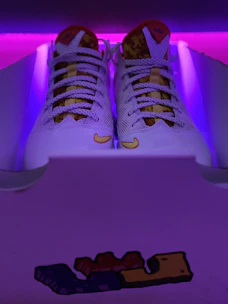 Sneaker box glowing with neon lime light, ready for worldwide shipping