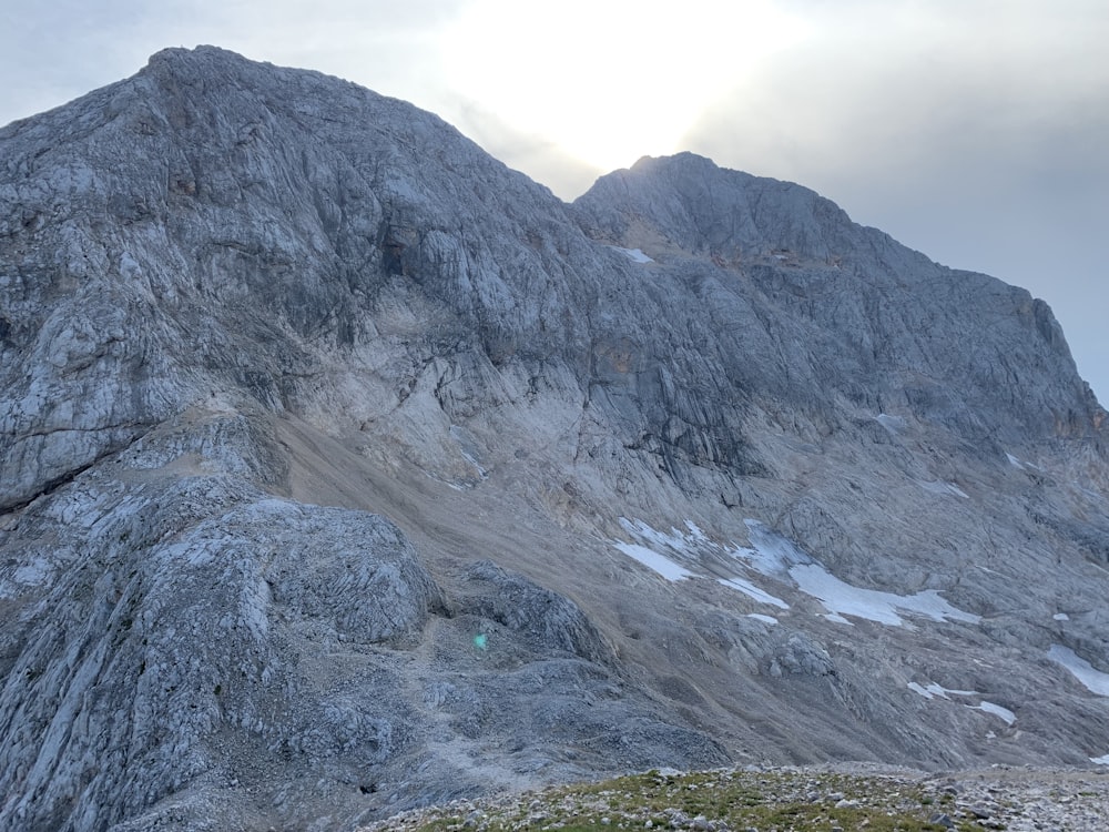 a rocky mountain with snow