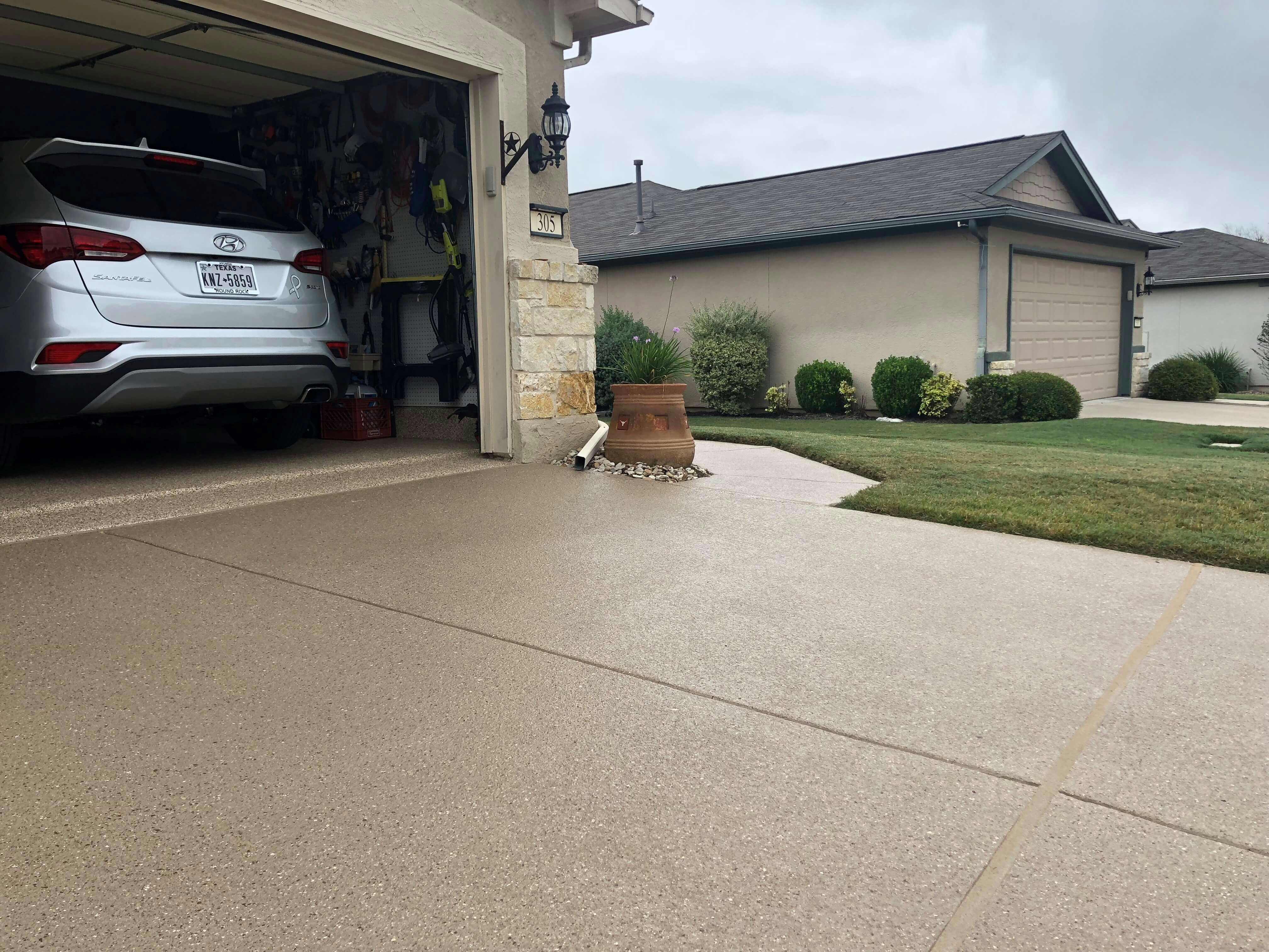 Colored concrete driveway installated in Galveston