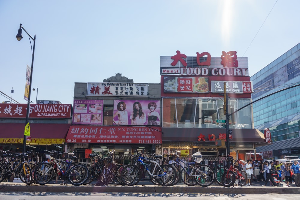 a group of bicycles parked outside of a building