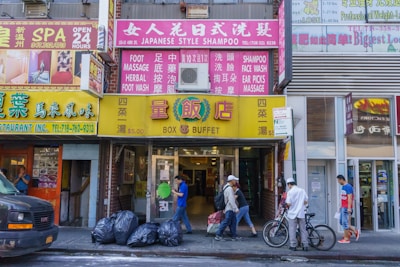 Street view of a busy commercial district with shops and offices.
