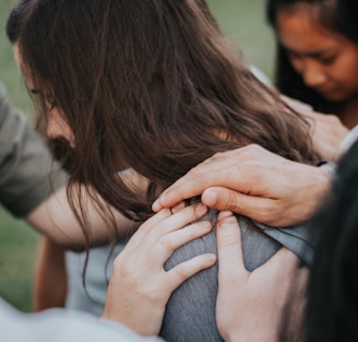 a person holding the hands together