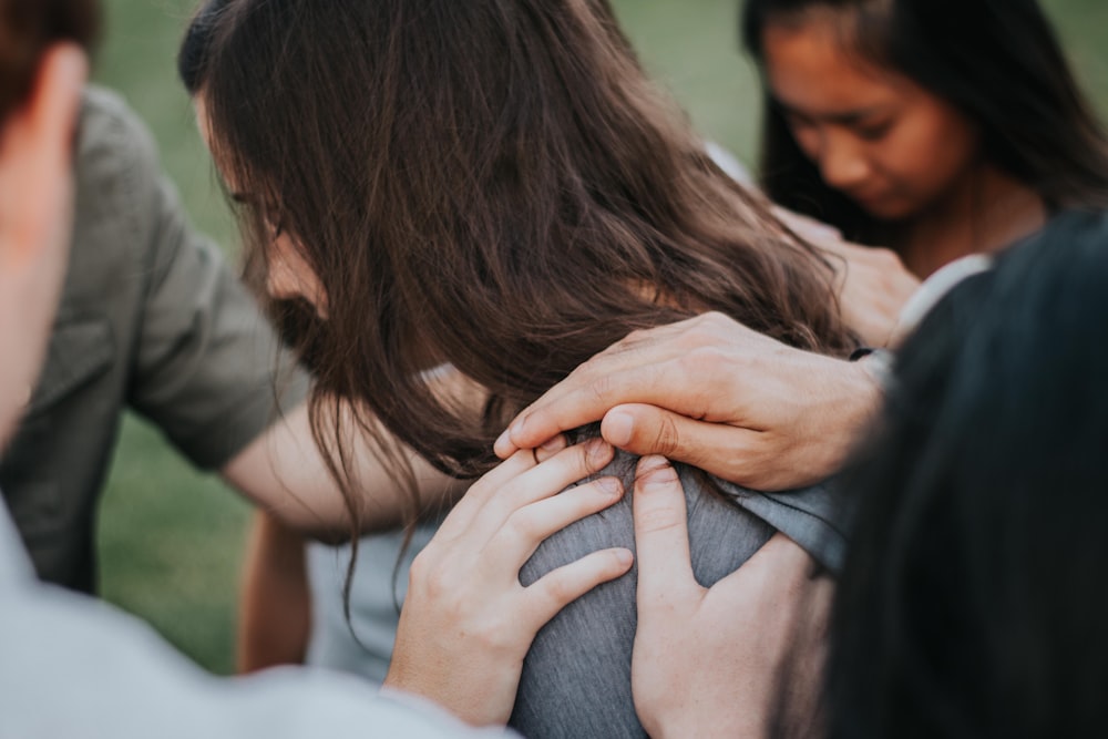 a person holding the hands together