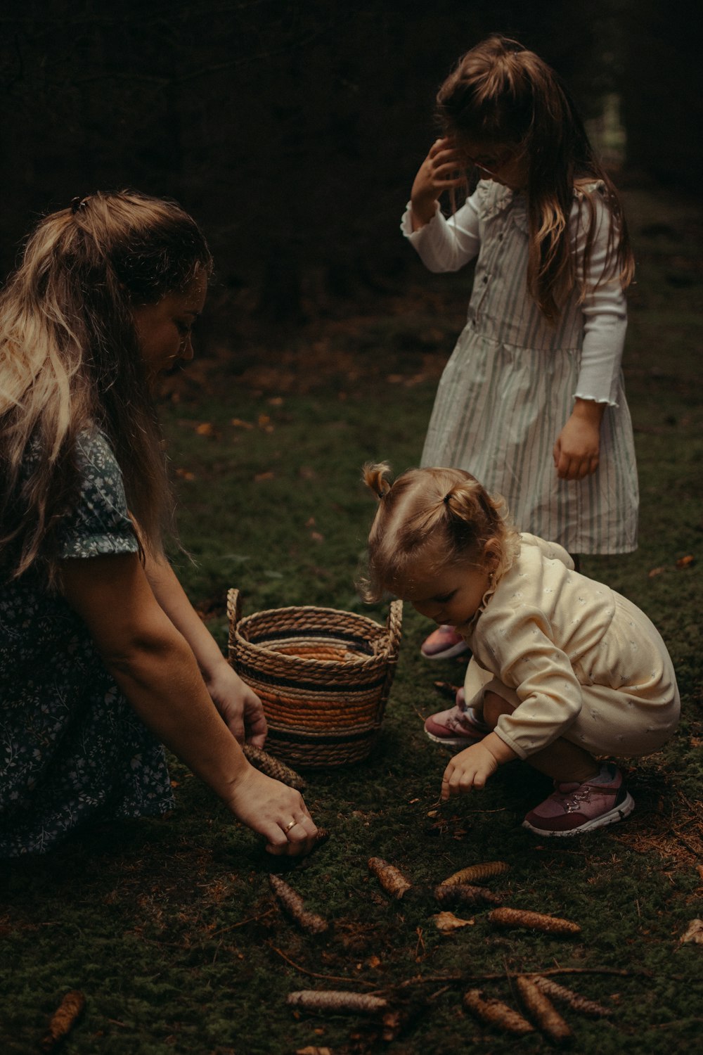 a group of children playing with a basket