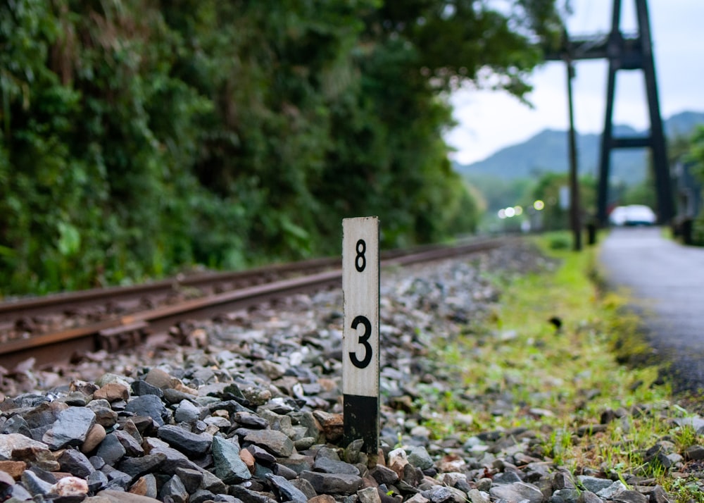 a train track with a sign on it