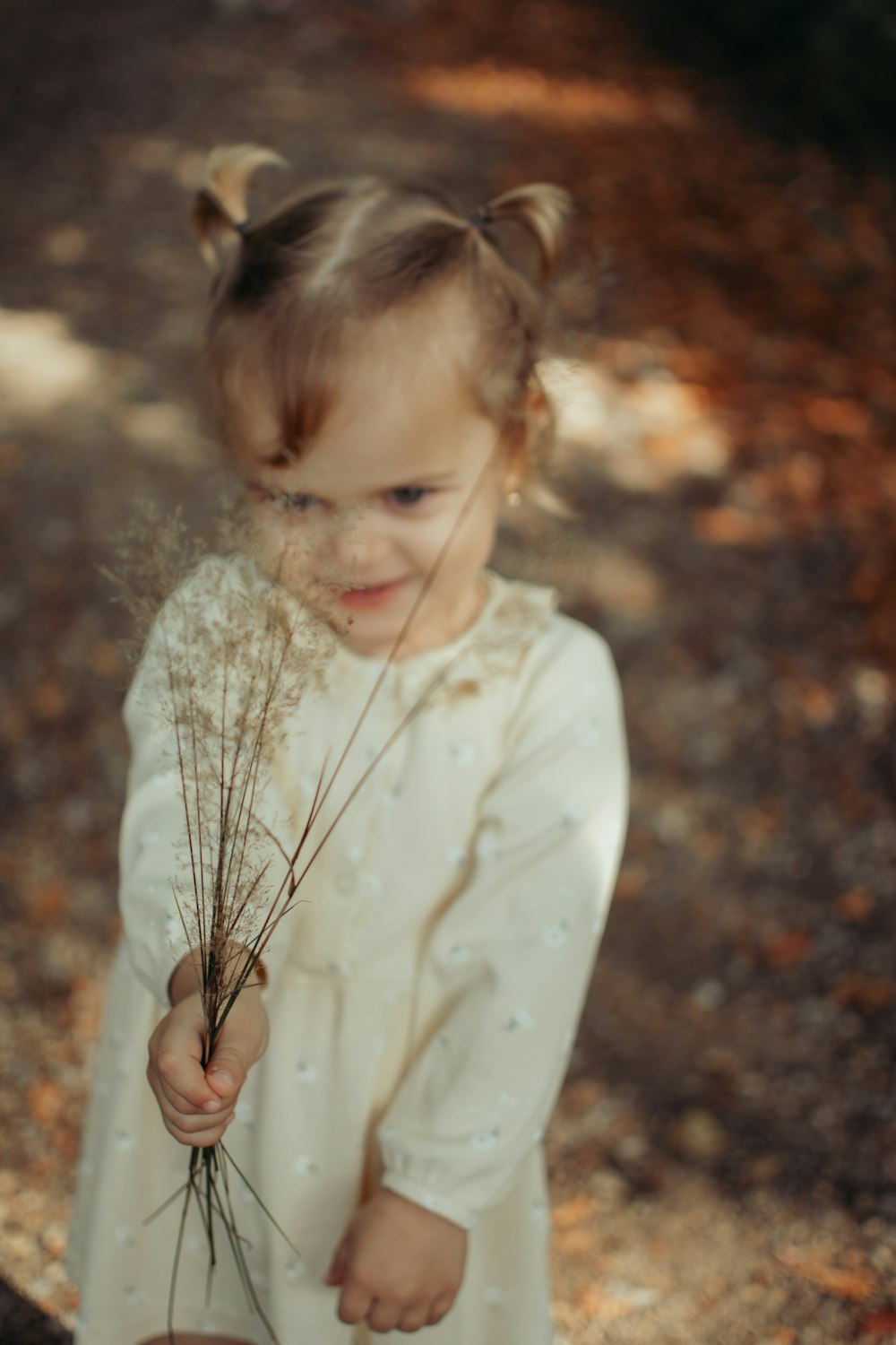 a little girl holding a rope